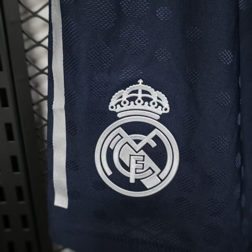 Navy player shorts featuring Real Madrid crest on the front