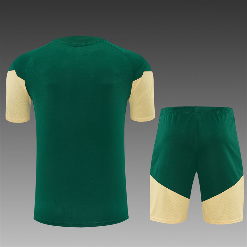 Green training jersey and shorts set, cream side panels, athletic stripe trim