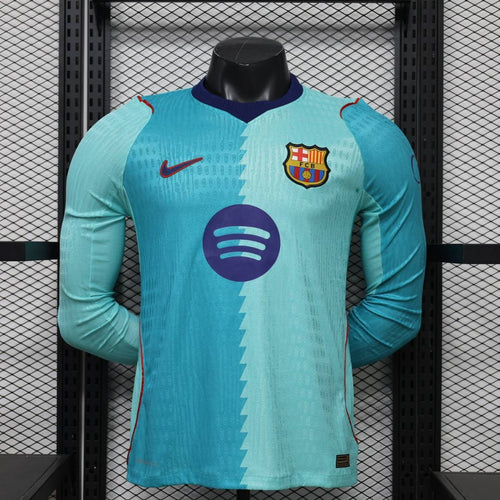Turquoise long-sleeve football jersey with FC Barcelona crest and sponsor logo