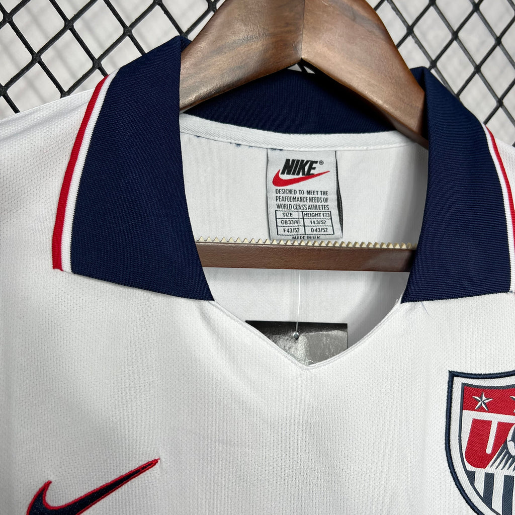 White jersey collar with Nike label and USA crest patch at chest