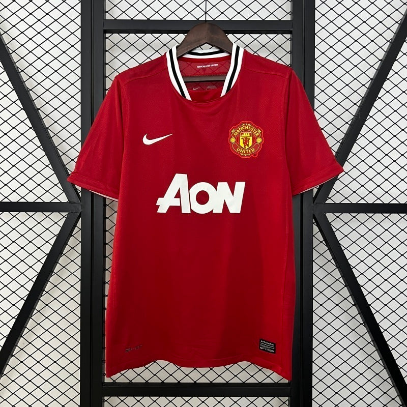 Manchester United 2011/12 home soccer jersey, red with Nike swoosh, AON, and crest