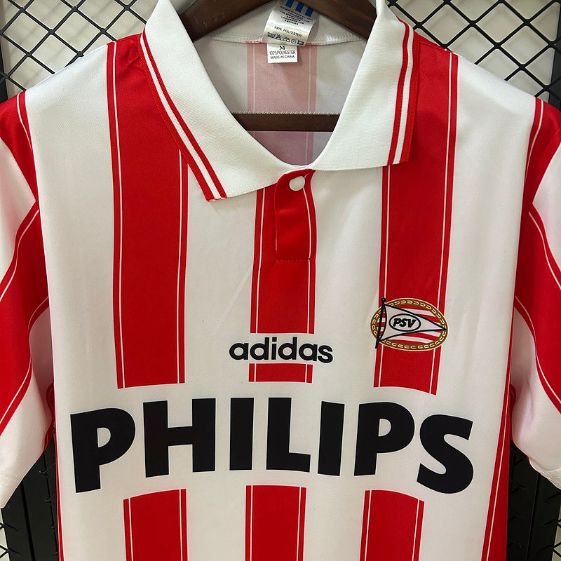 Red-and-white striped soccer jersey front close-up with adidas logo, PHILIPS, and PSV crest