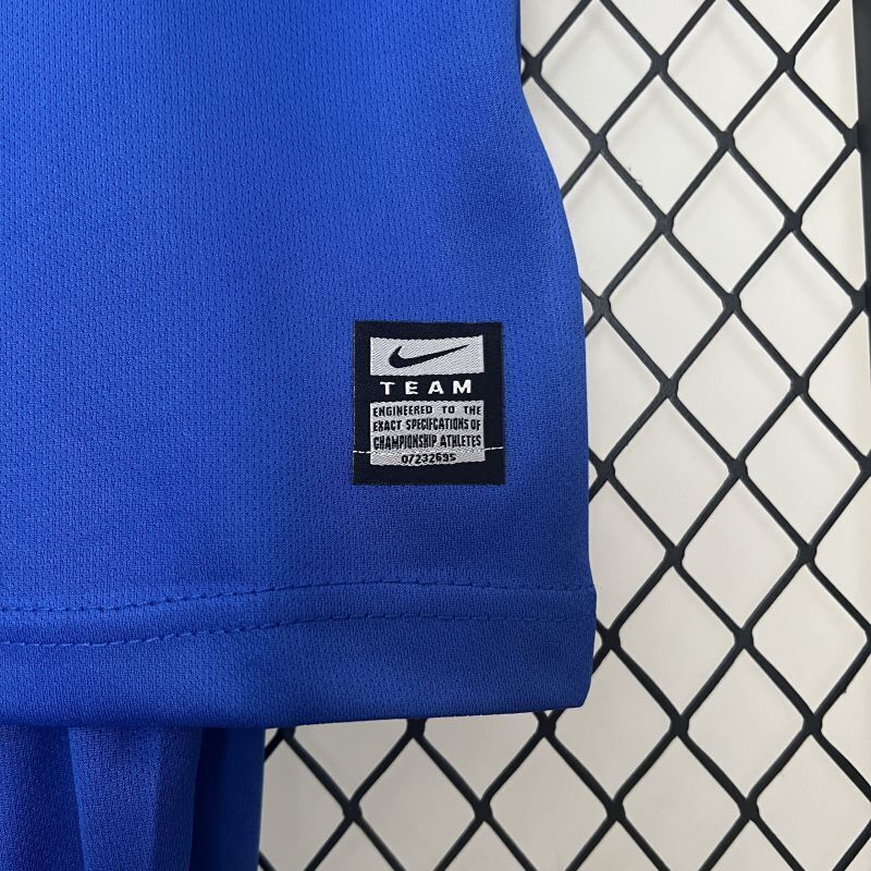 Blue kids jersey hem with Nike Team label and small size tag