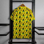 Retro football jersey back, yellow-green zigzag print with red collar and sleeve stripes