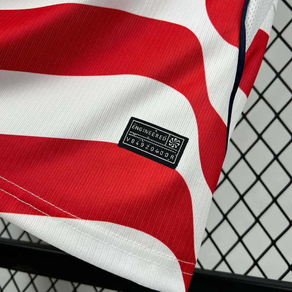 Engineered label on red-and-white striped soccer jersey fabric