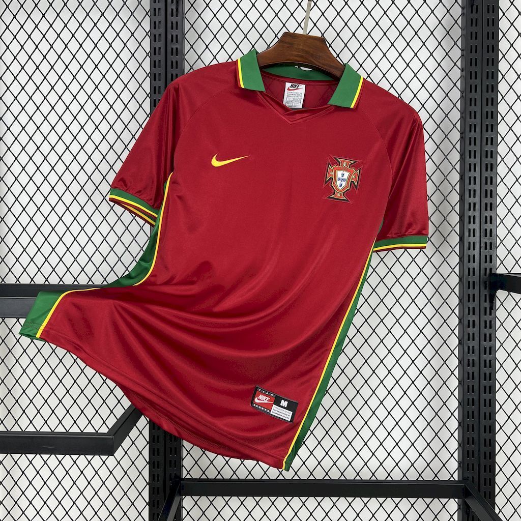 Maroon football jersey with green trim, yellow piping, and team crest
