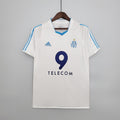 White retro home football jersey with blue V-neck, number 9, and TELECOM sponsor
