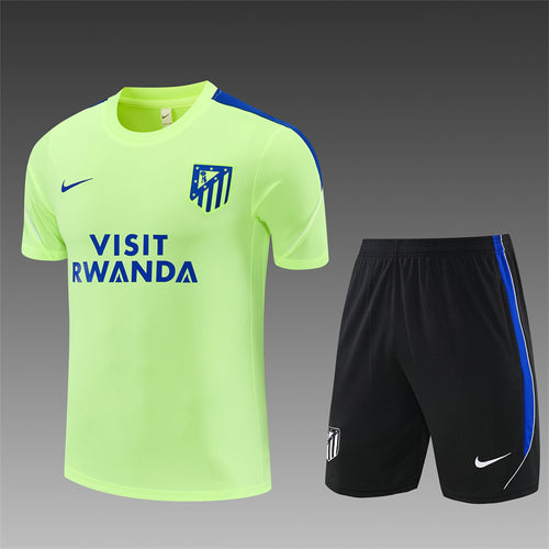 Yellow training jersey and black shorts set with blue stripes and team crest