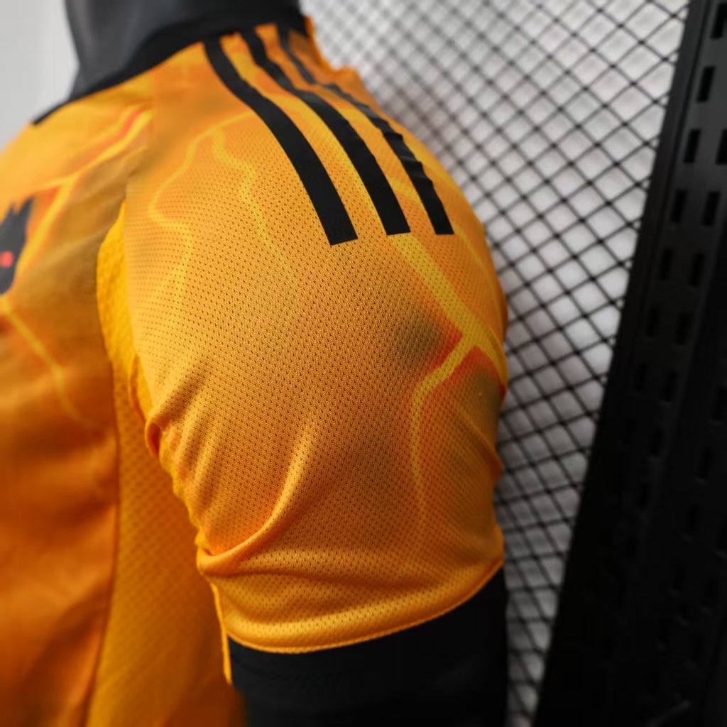 Orange jersey side view with black adidas sleeve stripes