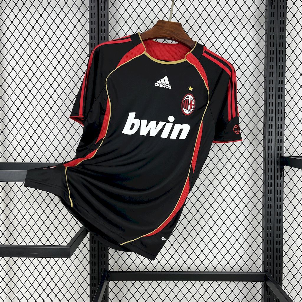 Black AC Milan retro football jersey with red and yellow trim, front crest and sponsor print