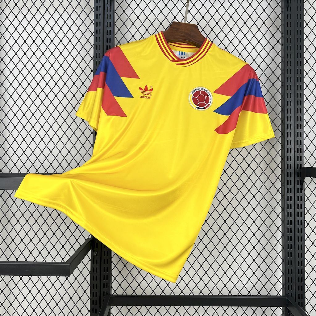 Yellow Colombia retro home soccer jersey with maroon and blue geometric panels