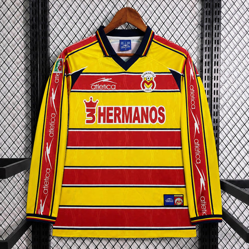 Yellow and red long-sleeve soccer jersey with V-neck and 'Hermanos' sponsor stripes