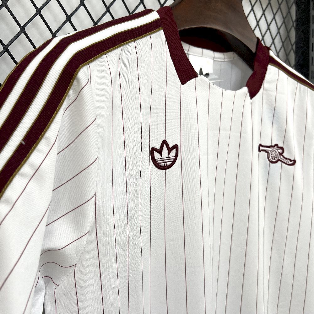 Arsenal 2025/26 terrace icons football shirt, maroon collar and chest crest on white