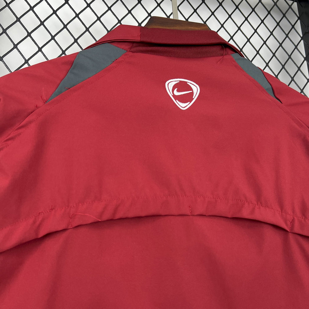 Red windbreaker jacket with Arsenal crest and Nike logo on upper back