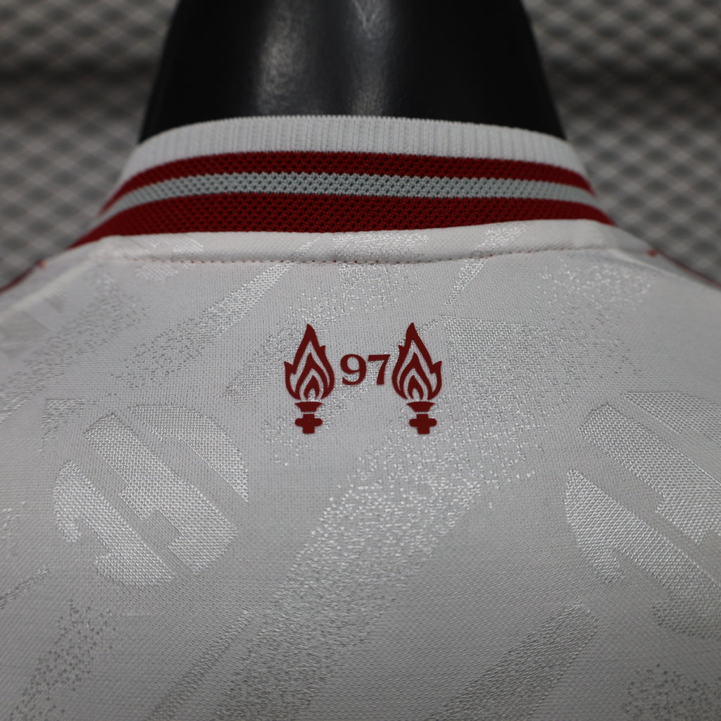 Liverpool FC away jersey back detail, red club crest near ribbed collar