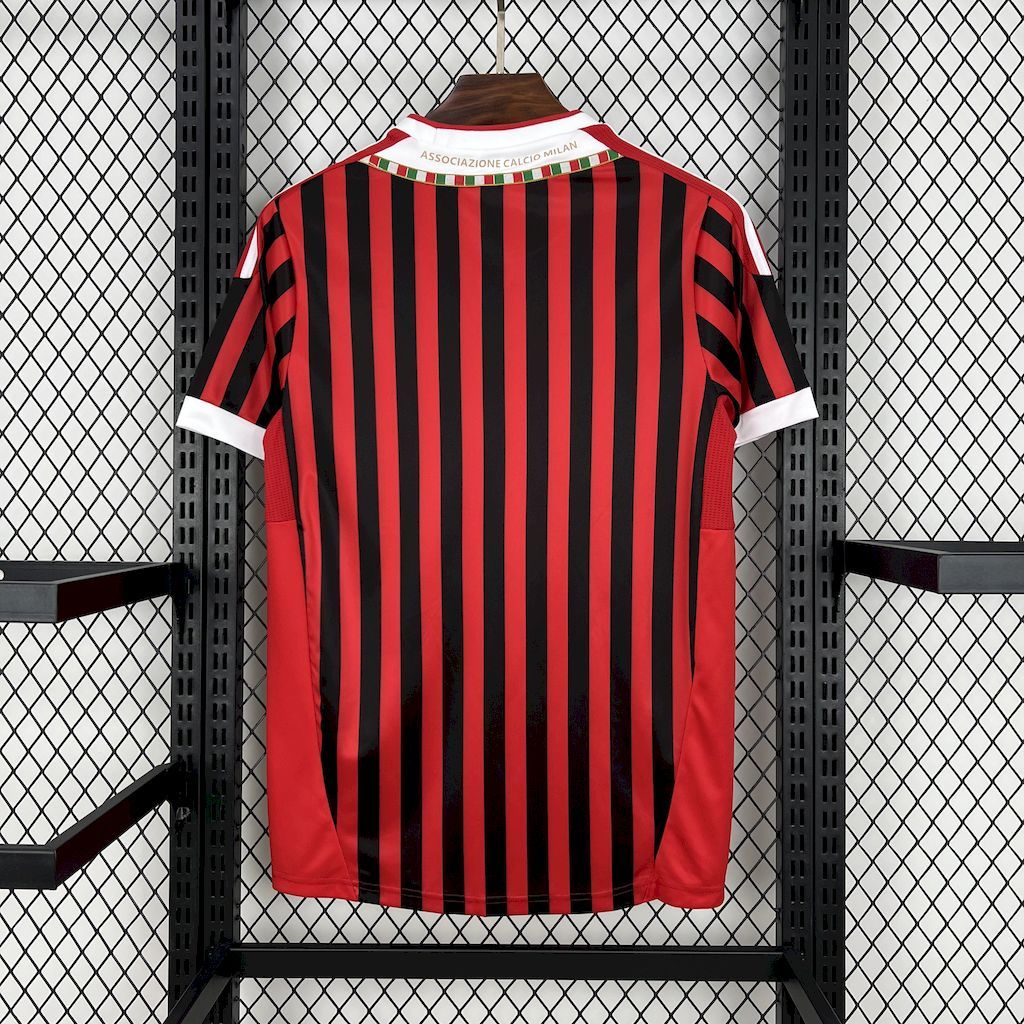 AC Milan home jersey back view with red-and-black vertical stripes and white collar