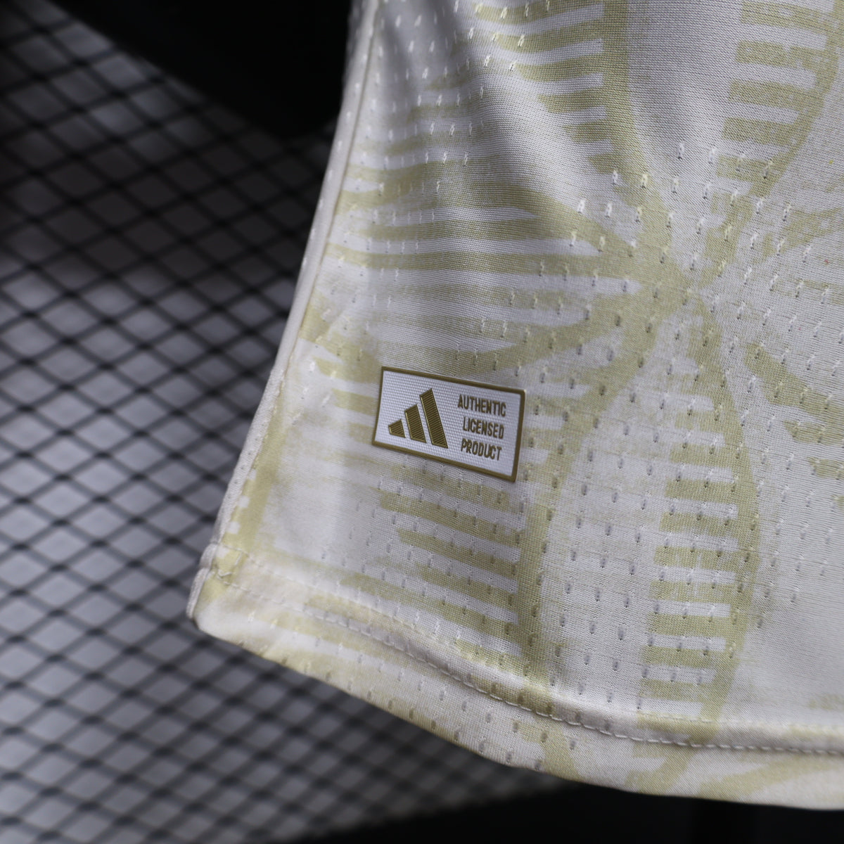 Light yellow jersey side authenticity label badge