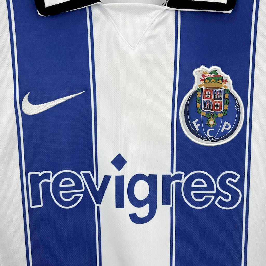 Retro Porto home jersey close-up: revigres text, blue stripes, Nike swoosh