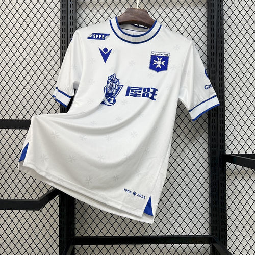 White football home jersey with blue trim, crest and sponsor graphics