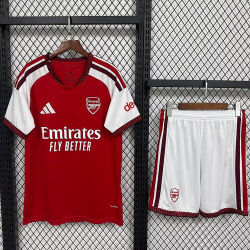 Kids football kit on hangers: red-and-white jersey with Arsenal crest, white shorts