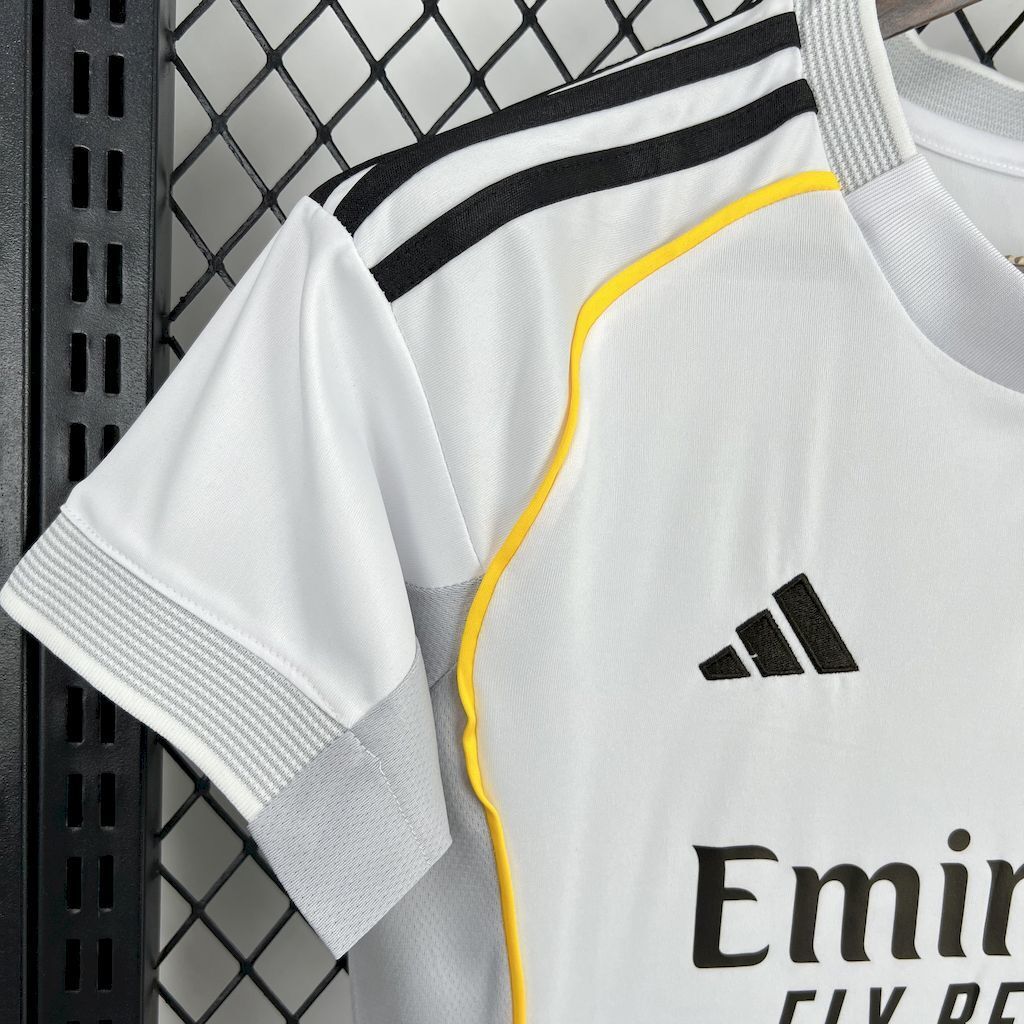 Women’s white football jersey with Adidas logo and partial Emirates sponsor text