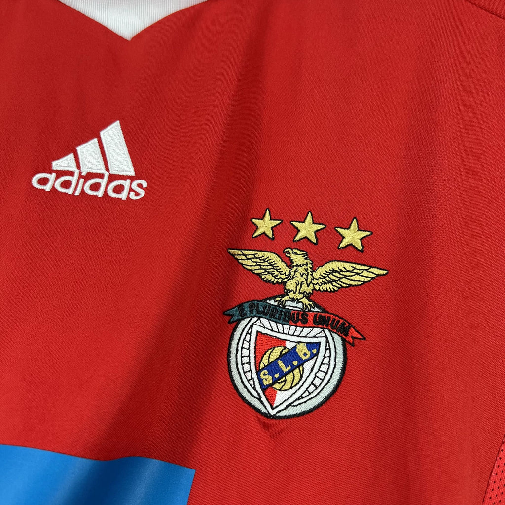 Red soccer jersey close-up with adidas logo and Benfica club crest