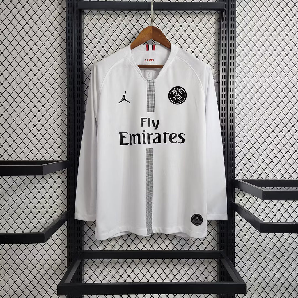 White PSG long-sleeve soccer jersey with Fly Emirates front print and PSG crest