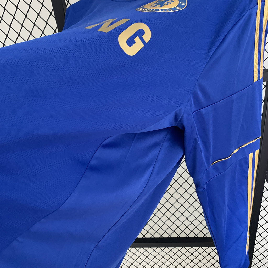 Blue long-sleeve soccer jersey with gold LG print and side stripe detail