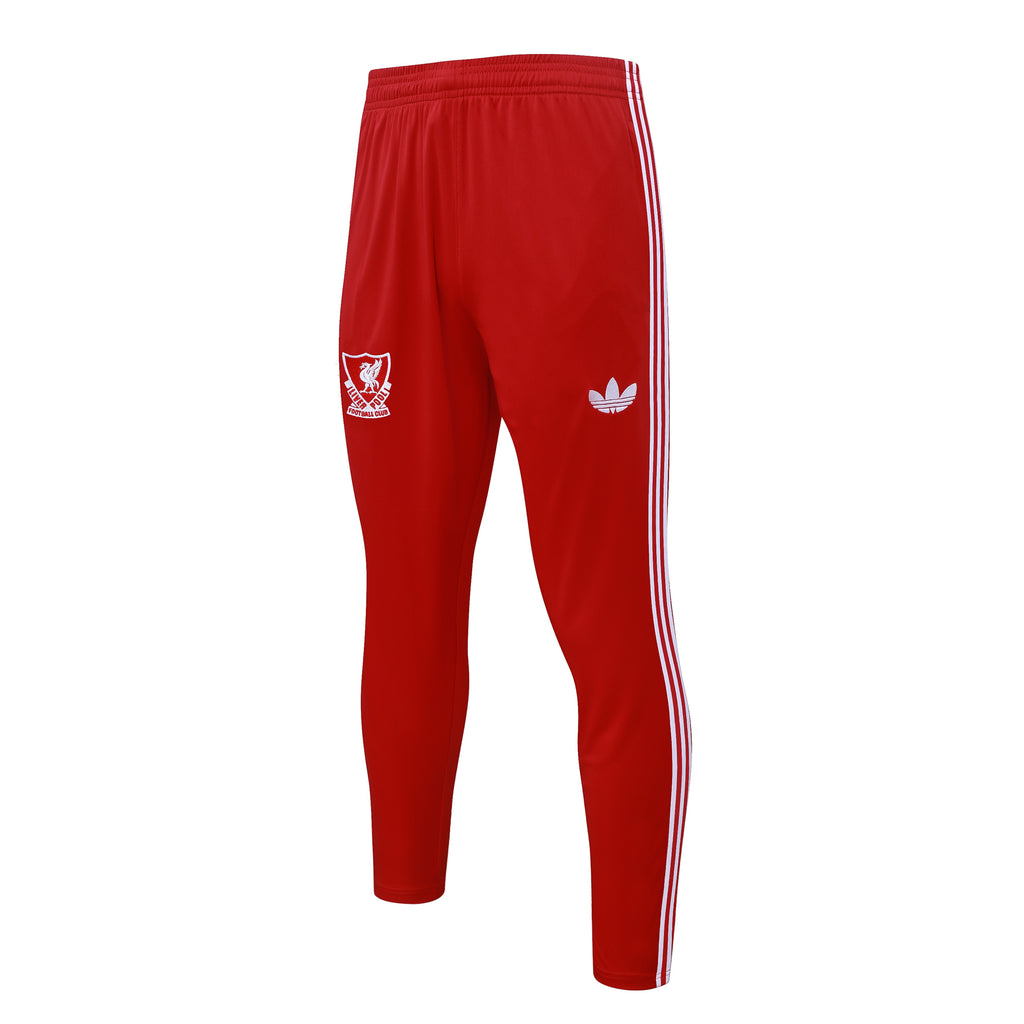 Red track pants with white vertical side stripes and small crest logo near the leg.