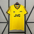 Yellow soccer jersey with black trim, JVC sponsor, adidas logo, short sleeves