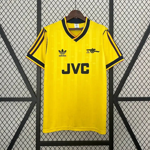Yellow soccer jersey with black trim, JVC sponsor, adidas logo, short sleeves