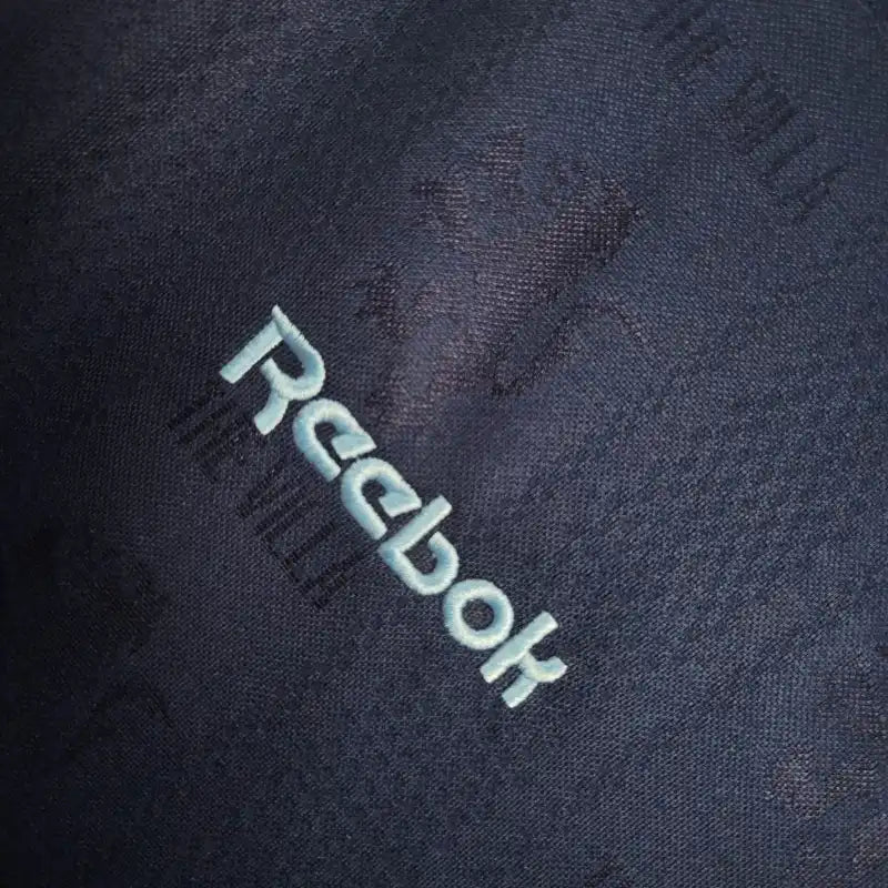 Reebok printed label on blue fabric