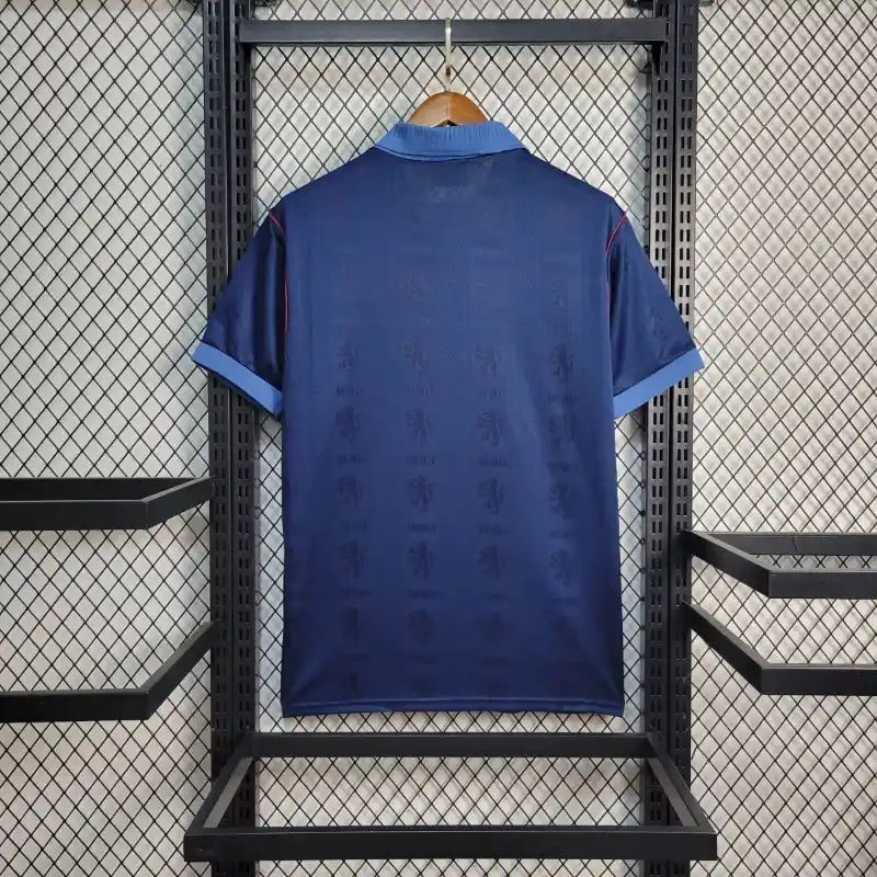 Blue retro football shirt back view with Reebok label and red-trim details