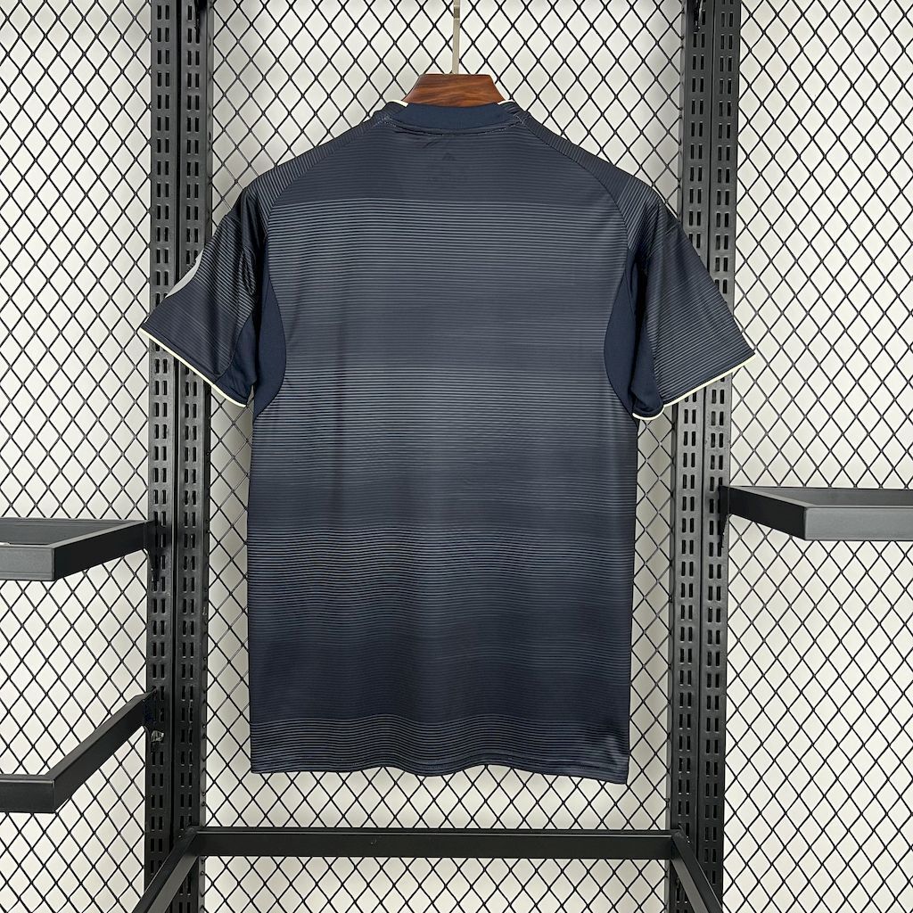Dark navy Real Madrid away fan jersey back view with ribbed texture and short sleeves