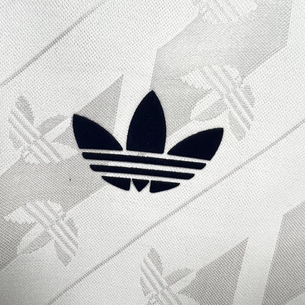 Adidas logo on white Real Madrid OG casual shirt, close-up