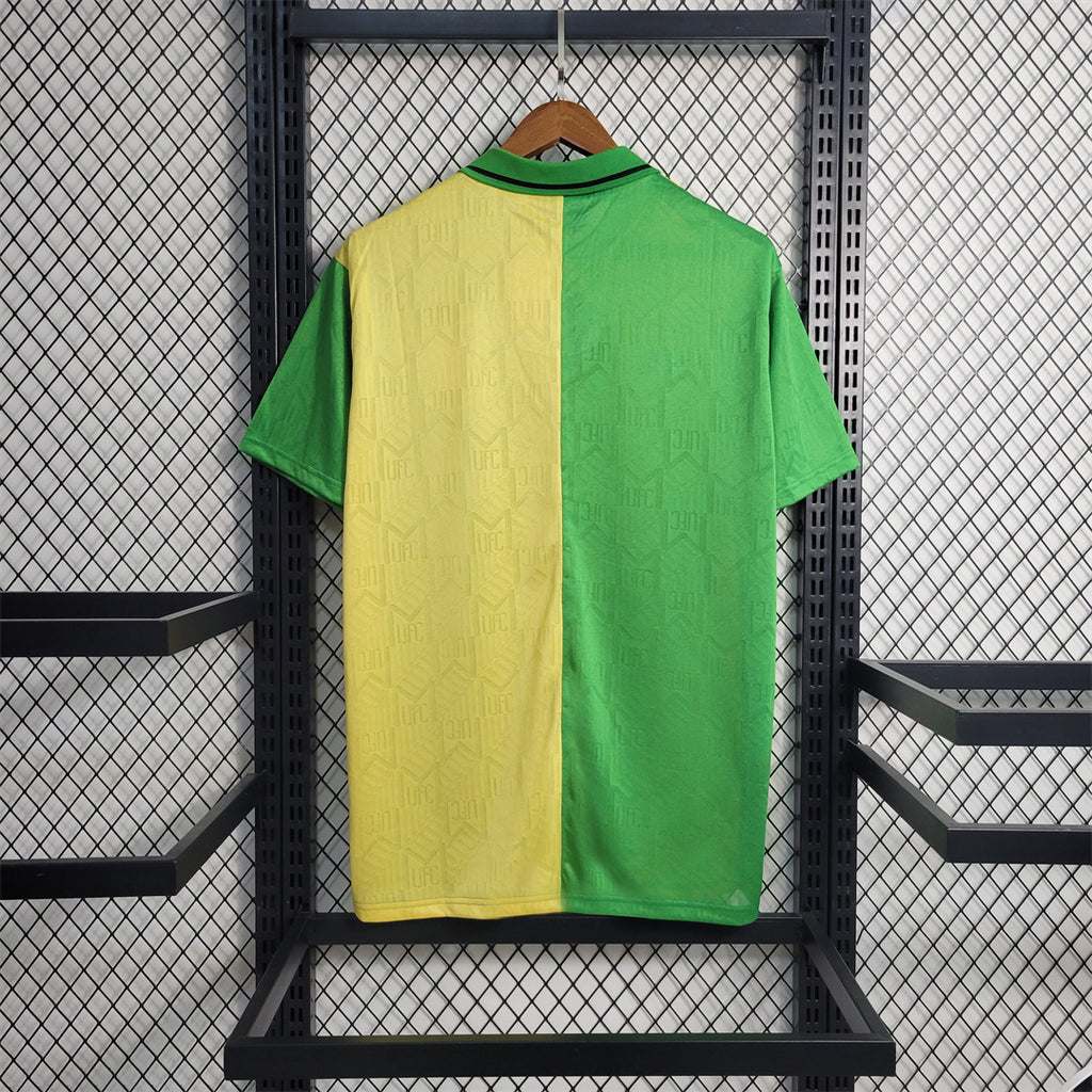 Green and yellow split retro football jersey shown from the back