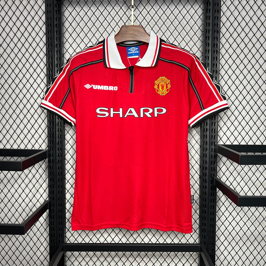 Red Manchester United style home soccer jersey with white collar and side stripes