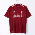 Red Liverpool FC retro home jersey on hanger, white collar trim, LFC crest, Standard Chartered