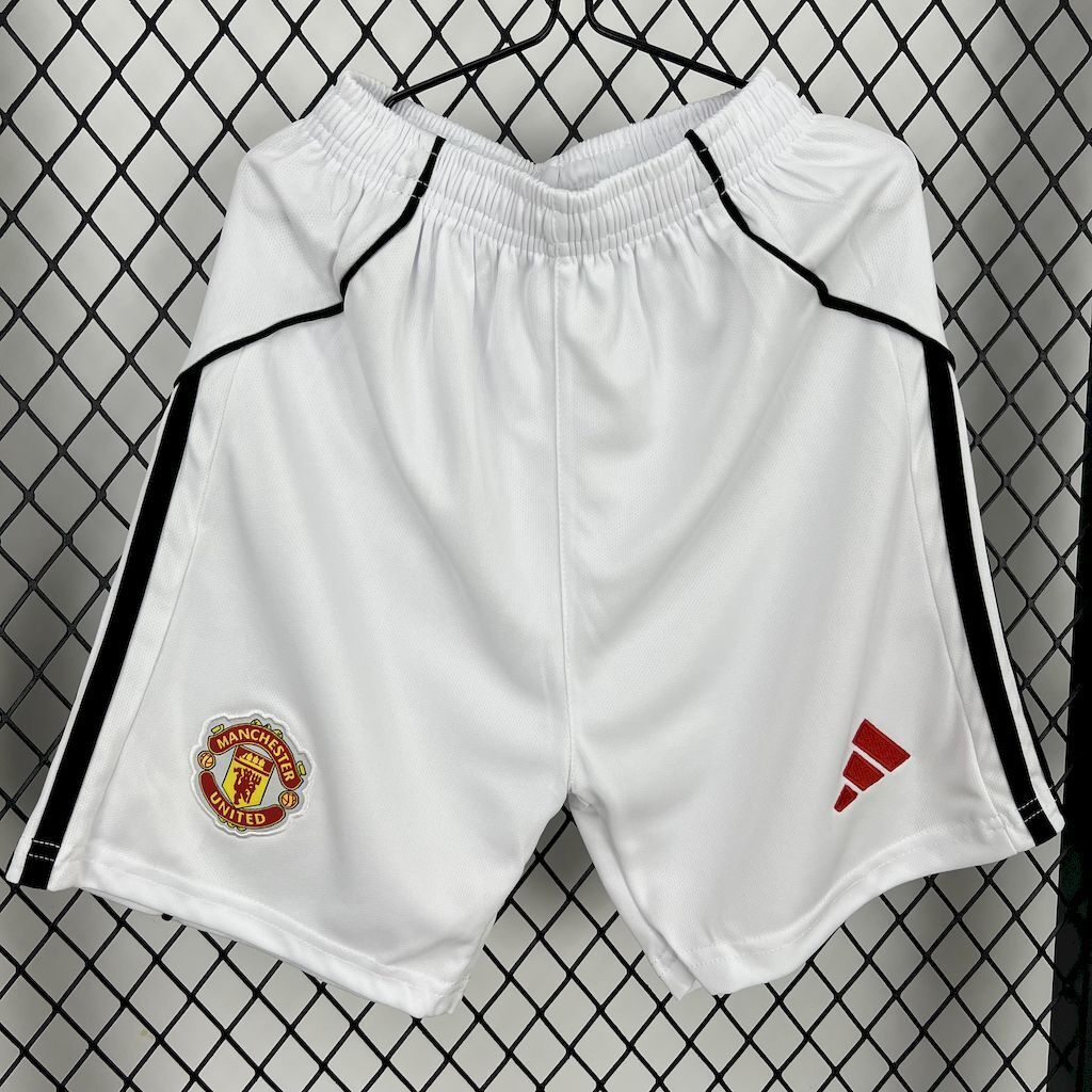 Kids white home shorts with black side stripes, Manchester United crest and red adidas mark