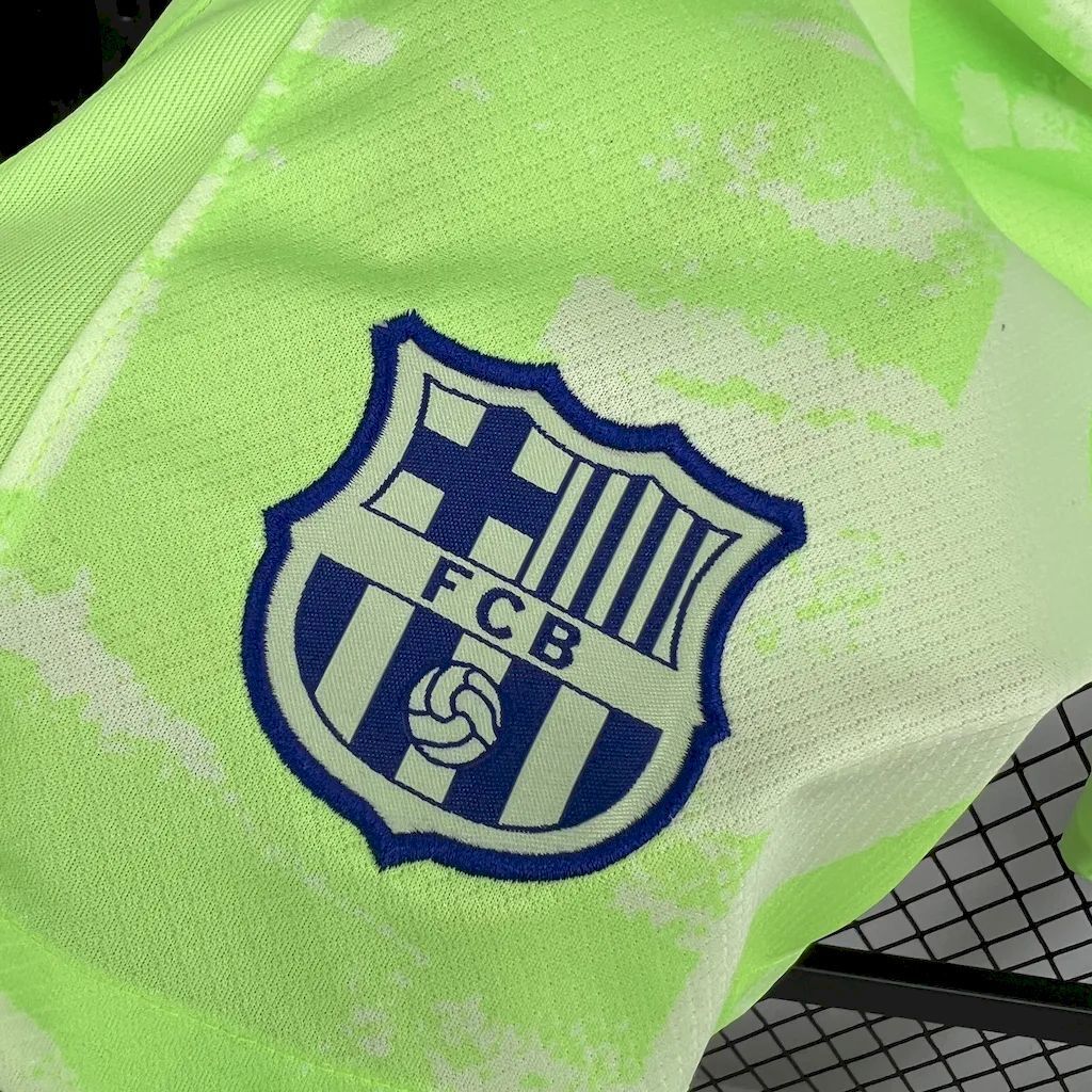 Neon lime shorts with FCB crest logo on front.