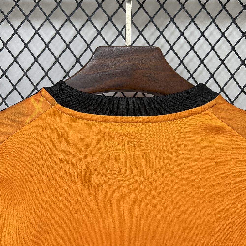 Orange soccer jersey neckline with black ribbed crew collar