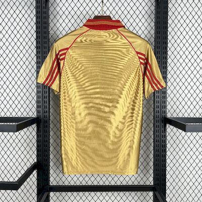 Yellow retro away soccer jersey with red shoulder stripes and back panel