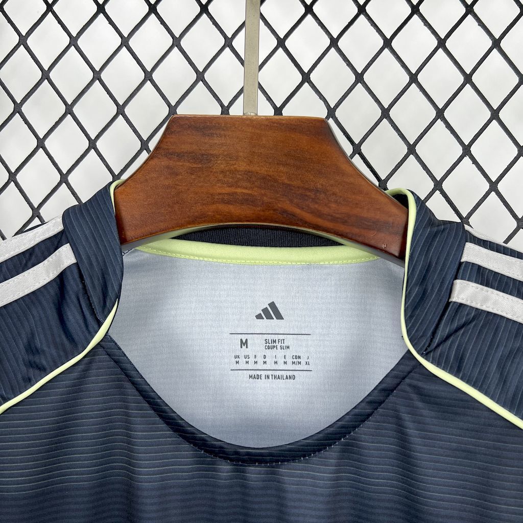 Dark navy football jersey collar with lime trim and Adidas size label (M)