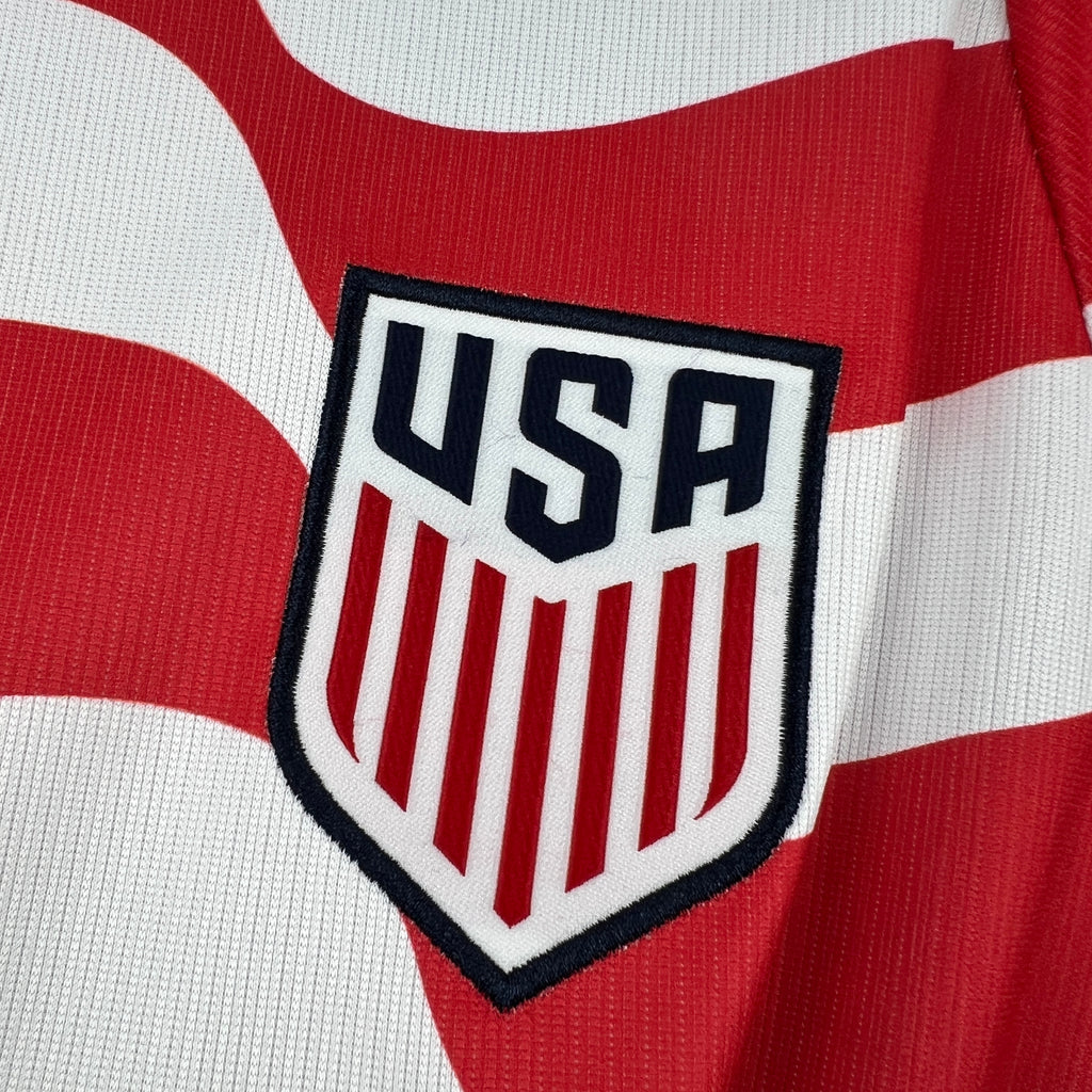 USA shield crest on a red-and-white striped soccer jersey