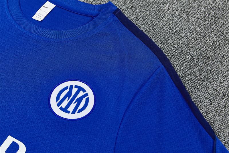 Blue training jersey with round Inter crest patch on chest