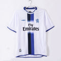 White soccer jersey with blue vertical stripe and Fly Emirates sponsor print
