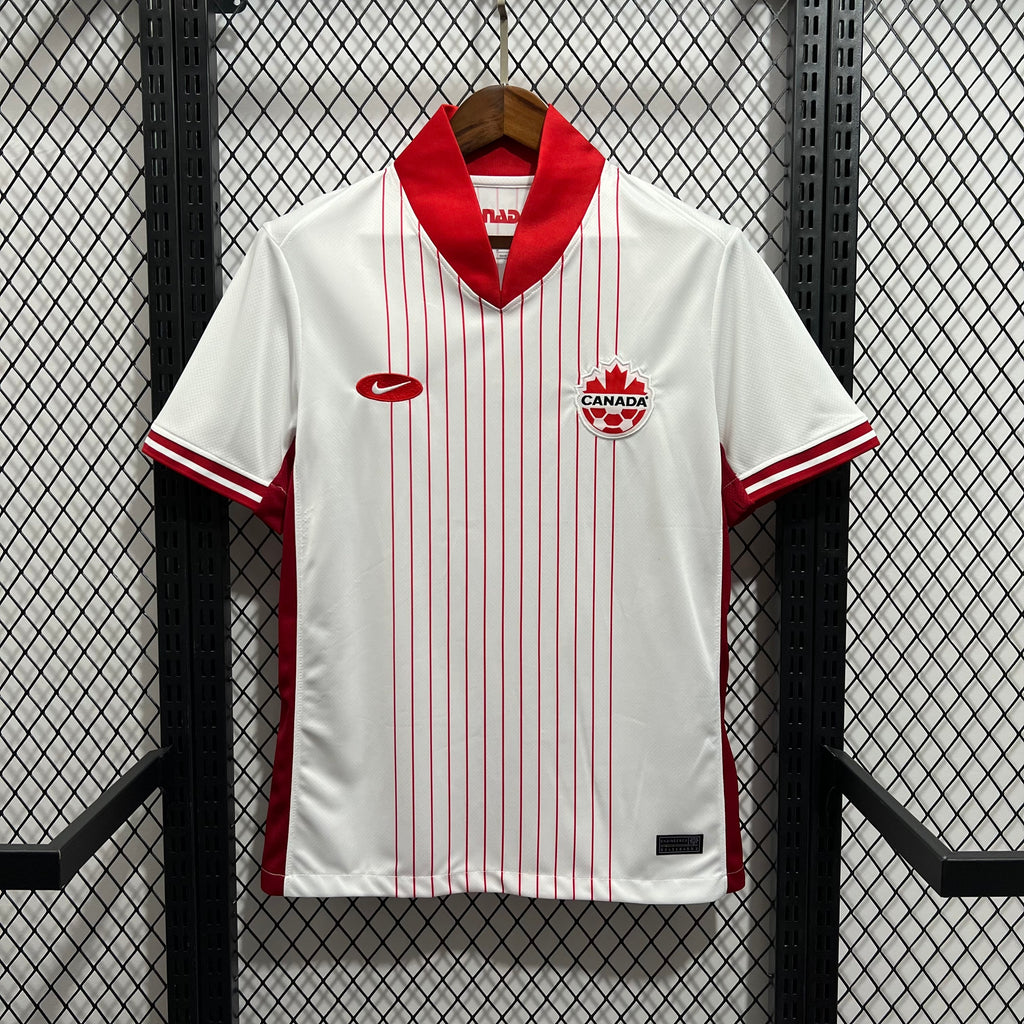 White soccer jersey with red vertical stripes, red V-neck collar, Canada crest
