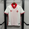 White soccer jersey with red vertical stripes, red V-neck collar, Canada crest