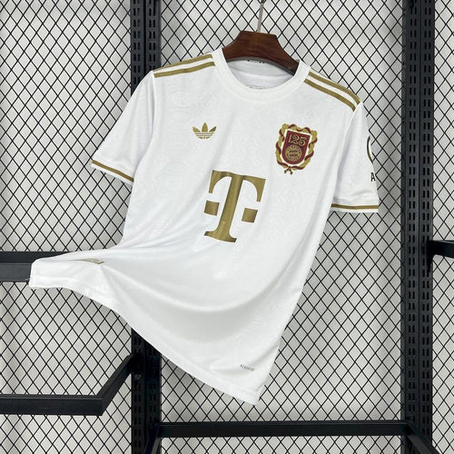 White Bayern Munich fan jersey with gold trim, crest patch, and large front number detail