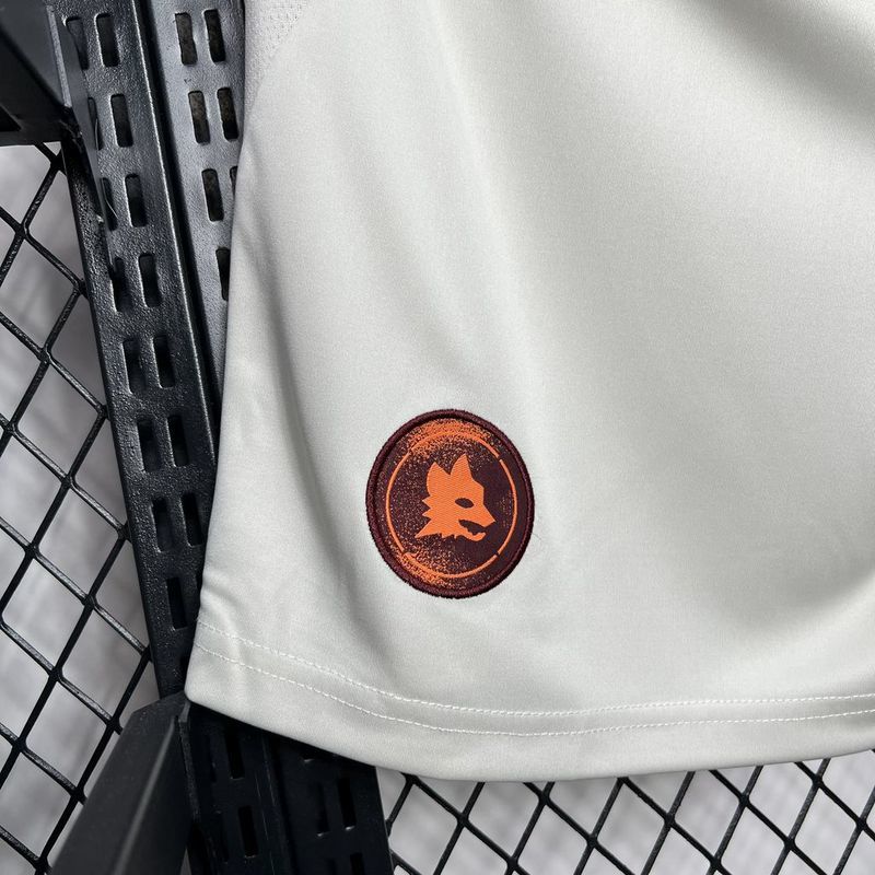 White fan shorts with orange circular crest patch